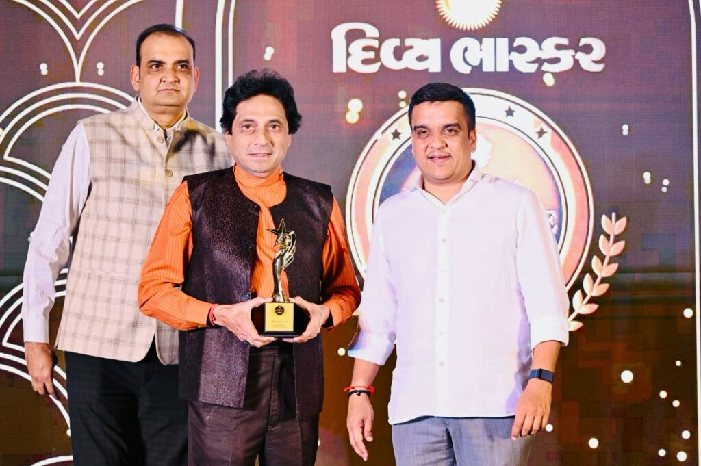 Writer and poet Dipak Desai received the Gujarat Excellence Award from Gujarat Home Minister Harsh Sanghavi