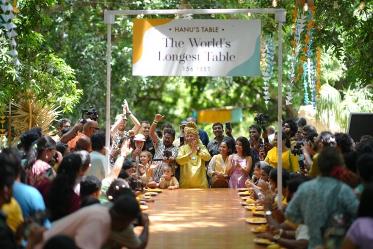 HanuReddyMangoTourism 2025:India’sMangoStoryStartsHereTheExperienceThe Great Mango Festival returns for its 2025 edition, curated by Hanu Reddy Mango Tourism, with a series of vibrant celebrations on June 1st, 8th, 15th, and 22nd. Set within the heart of the 70-year-oldHanuReddyRaghavaFarms,thiseventofferstheperfectsummerescapejust30km from Chennai. A lush mango orchard, a 156-foot-long community table, and over 25 immersive experiences await guests of all ages.Mangoloversandfamiliescanindulgeinamango-infusedbreakfastunderthemangotrees,play traditional games, enjoy hands-on farm life, explore crafts, and shop at a curated mini market promoting sustainable brands. The festival is more than an event—it’s a celebration of culture, tradition, and India’s beloved king of fruits.VisionAtthecoreofHanuReddyMangoTourismisapowerfulpurpose:Topromotemangotourismof India by creating meaningful, experience-driven opportunities that generate economic value for farmers—offering globally sought-after farm experiences in addition to selling their produce.MissionAtHanuReddyMangoTourism,we’reonaheartfeltmissiontosharethemagicofIndia’s mango with the world—through joyful, thoughtfully curated experiences that honor our traditions, embrace sustainability, and celebrate community. Hanu’sTable:TheWorld’sHappiestTableCraftedfromtreesfelledbyCycloneVardahin2016,the156-ft-longtablesymbolizesresilience, community, and creativity. Nestled beneath the orchard canopy, it invites strangers and friends alike to dine, bond, and celebrate together. FestivalHighlightsMangoliciousBreakfast